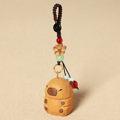 【2個でお得！組み合わせ自由】【カピバラの置物｜カピバラのバッグチャーム】 ナチュラル 可愛い 手作り 木彫り カピバラグッズ 置物 バッグチャーム 癒し 厄除け オブジェ ストラップ 小さい 玄関 風水 引越し祝い 贈り物 プレゼント 幸運 お守りストラップ ミニチュア 木製雑貨 - RabbPig