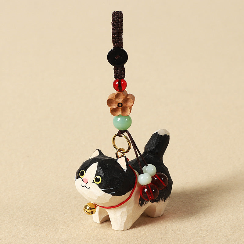 手作りの白黒猫の木製バッグチャーム。シナノキと天然石を使用した、お守りとしても最適な贈り物。