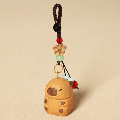 手作りの可愛いカピバラの木製チャームと木製置物。天然木材と天然石を使用した、お守りとしても最適な贈り物。