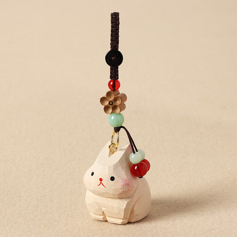 手作りの兎の木製チャームと木製置物。天然木材と天然石を使用した、お守りとしても最適な贈り物。